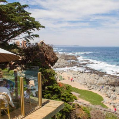 Isla Negra, Chile; November 20, 2017: Tourists enjoying a lunch in the restaurant of Pablo Neruda's house in front of Pacific Ocean.